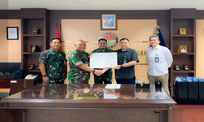 The signing and handing over of a certificate of seaworthiness, Certificate of Approval (COA) Military Maintenance, Repair and Overhaul by the Head of the Indonesian Ministry of Defence to the Director of PT. BTI Indo Tekno